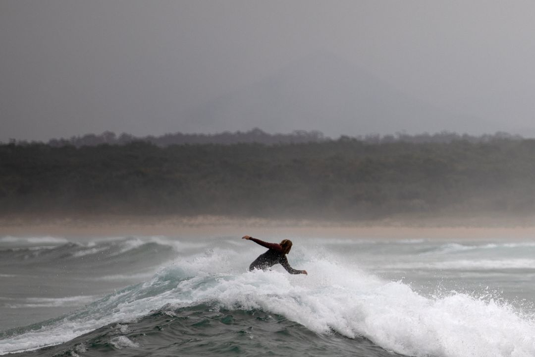 A surfer rides a wave in Bengello beach in Broulee, Australia January 14, 2020. Picture taken January 14, 2020. REUTERS Alkis Konstantinidis A surfer rides a wave in Bengello beach in Broulee, Australia January 14, 2020. Picture taken January 14, 2020. REUTERS Alkis Konstantinidis