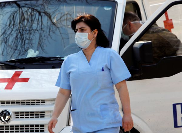 A medical staff member walks with a covered face to protect against the coronavirus disease (COVID-19) at the state hospital in Skopje, North Macedonia March 12, 2020. REUTERS/Ognen Teofilovski