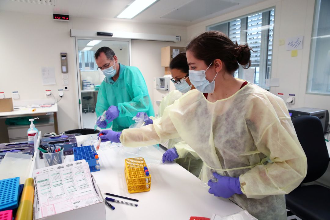 Staff members work as media visit the Microbiology Laboratory of the University Hospital (CHUV) during the coronavirus disease (COVID-19) Staff members work as media visit the Microbiology Laboratory of the University Hospital (CHUV) during the coronavirus disease (COVID-19)