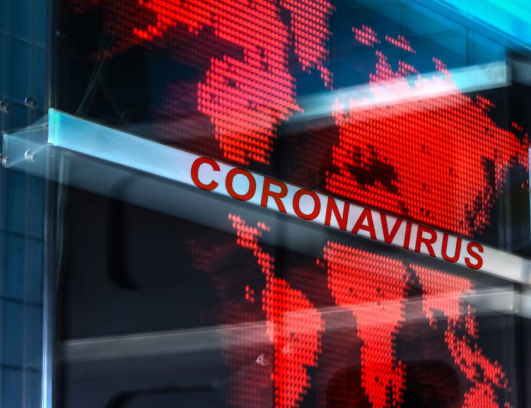 Pantalla con el mapamundi y la palabra Coronavirus Pantalla con el mapamundi y la palabra Coronavirus
