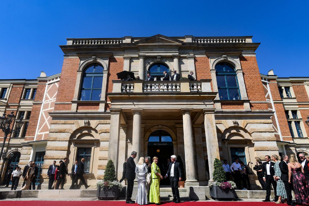 German Chancellor Angela Merkel (C), Bavarian State Prime Minister Markus Soeder (L) and his wife Karin (2-L) arrive for the opening of the 108th Bayreuth Festival at the Richard-Wagner-Festspielhaus in Bayreuth, Germany, 25 July 2019 German Chancellor Angela Merkel (C), Bavarian State Prime Minister Markus Soeder (L) and his wife Karin (2-L) arrive for the opening of the 108th Bayreuth Festival at the Richard-Wagner-Festspielhaus in Bayreuth, Germany, 25 July 2019