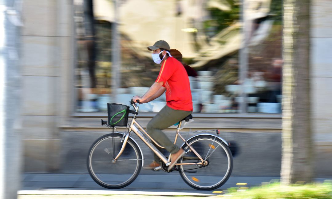 A man on a bicycle is wearing a protective mask, as the spread of the coronavirus disease (COVID-19) continues in Dresden, Germany, April 20, 2020 A man on a bicycle is wearing a protective mask, as the spread of the coronavirus disease (COVID-19) continues in Dresden, Germany, April 20, 2020