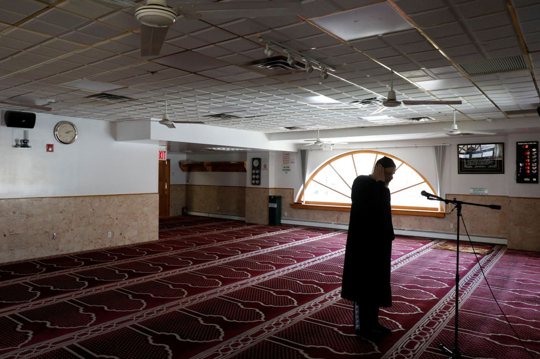 Imam Abdelghani Benyahya performs the afternoon call to prayer alone during the holiday of Ramadan at the Muslim Center of New York during the outbreak of the coronavirus disease (COVID-19), in the Queens borough of New York City, U.S., April 25, 2020. REUTERS Andrew Kelly Imam Abdelghani Benyahya performs the afternoon call to prayer alone during the holiday of Ramadan at the Muslim Center of New York during the outbreak of the coronavirus disease (COVID-19), in the Queens borough of New York City, U.S., April 25, 2020. REUTERS Andrew Kelly