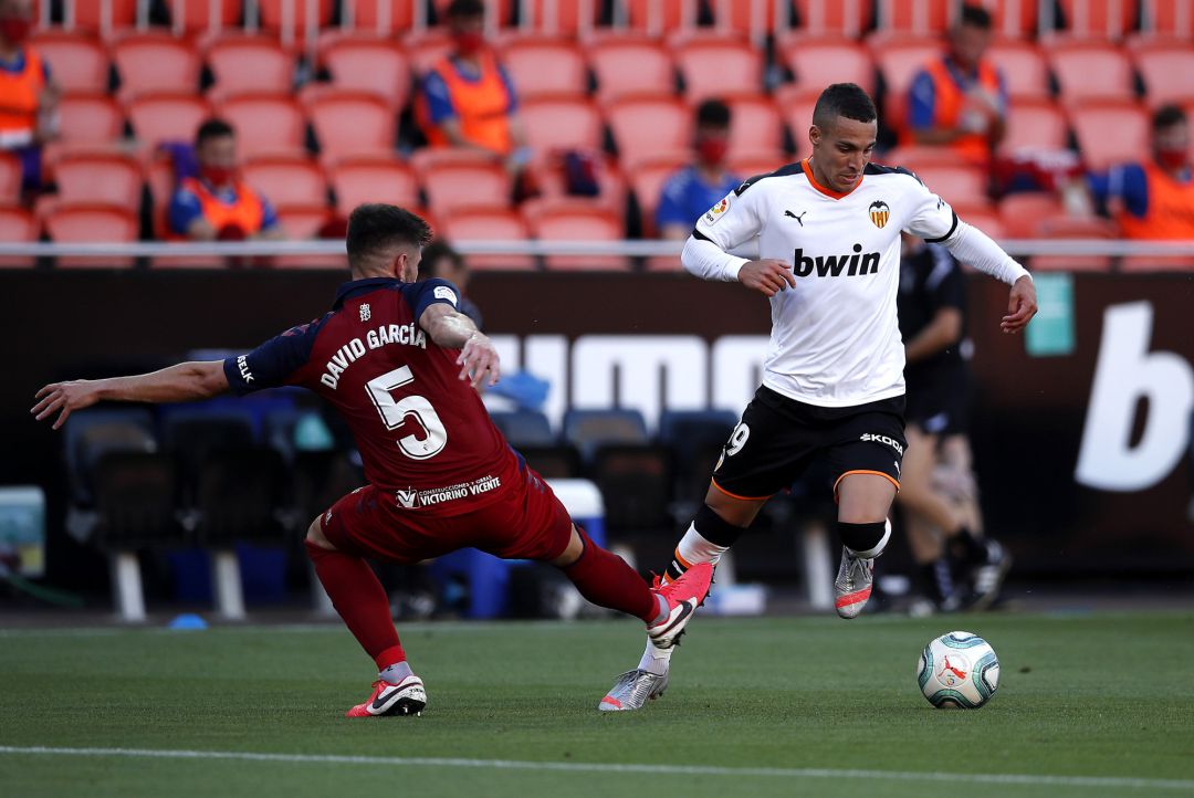 VALENCIA, SPAIN - JUNE 21: Rodrigo Moreno of Valencia CF battles for possession with Raul Navas of CA Osasuna during the La Liga match between Valencia CF and CA Osasuna at Estadio Mestalla on June 21, 2020 in Valencia, Spain. VALENCIA, SPAIN - JUNE 21: Rodrigo Moreno of Valencia CF battles for possession with Raul Navas of CA Osasuna during the La Liga match between Valencia CF and CA Osasuna at Estadio Mestalla on June 21, 2020 in Valencia, Spain.