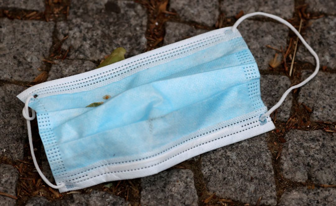 A used face mask is pictured on a street, following coronavirus disease (COVID-19) outbreak in Berlin, A used face mask is pictured on a street, following coronavirus disease (COVID-19) outbreak in Berlin,