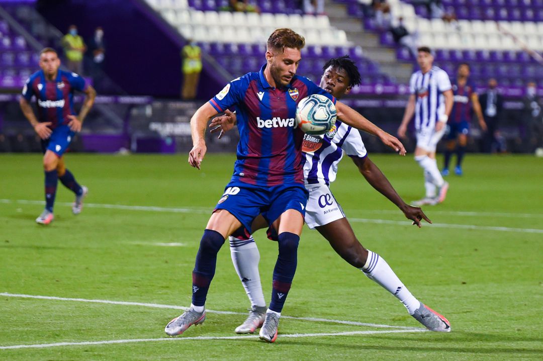 Ruben Rochina of Levante UD is tackled by Mohammed Salisu of Real Valladolid Ruben Rochina of Levante UD is tackled by Mohammed Salisu of Real Valladolid