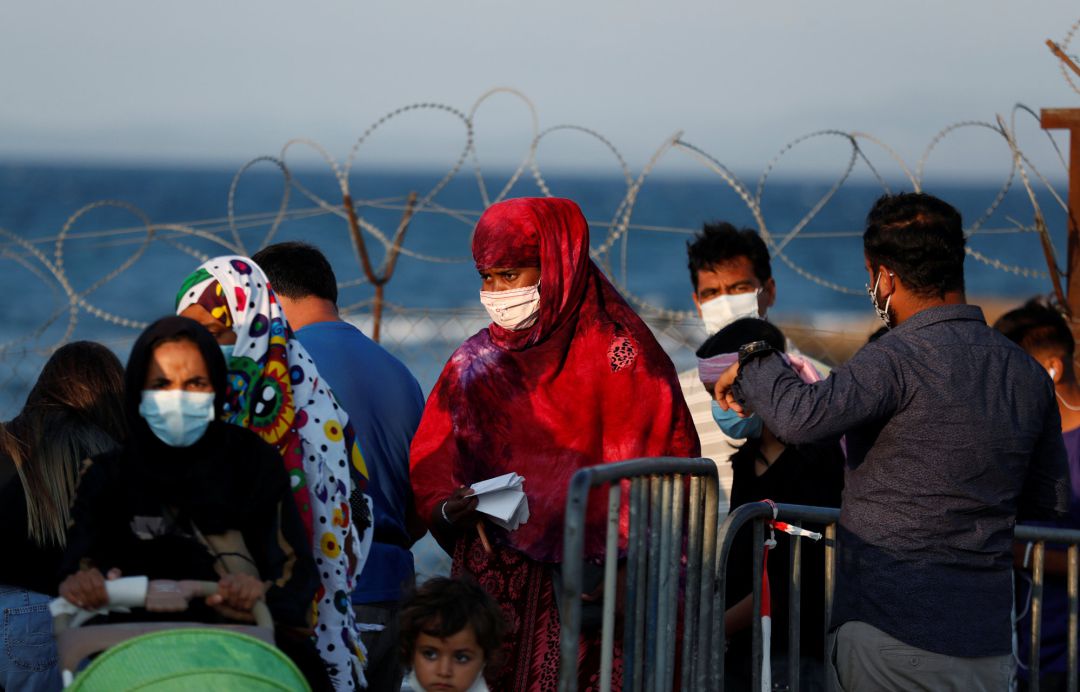 Algunos refugiados del campo calcinado de Moria Algunos refugiados del campo calcinado de Moria