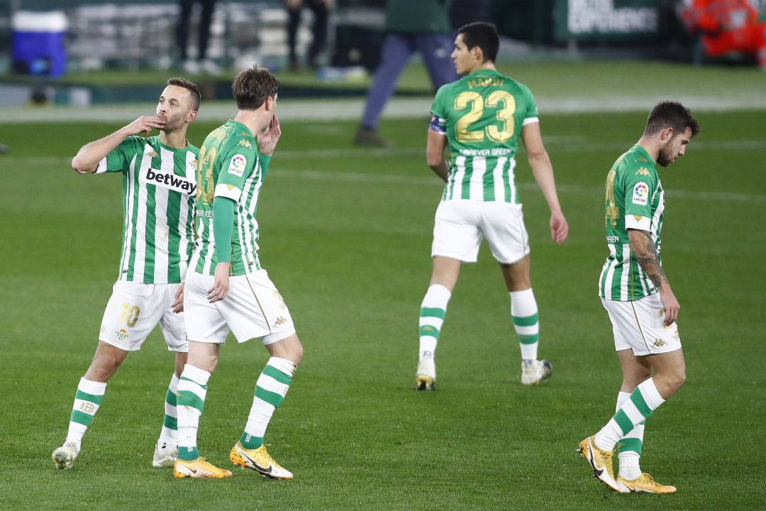SEVILLE, SPAIN - JANUARY 20: Sergio Canales of Real Betis celebrates with teammate Juan Miranda after scoring their team's first goal after scoring their team's first goal during the La Liga Santader match between Real Betis and RC Celta at Estadio Benito Villamarin on January 20, 2021 in Seville, Spain. Sporting stadiums around Spain remain under strict restrictions due to the Coronavirus Pandemic as Government social distancing laws prohibit fans inside venues resulting in games being played behind closed doors. (Photo by Fran Santiago Getty Images) SEVILLE, SPAIN - JANUARY 20: Sergio Canales of Real Betis celebrates with teammate Juan Miranda after scoring their team's first goal after scoring their team's first goal during the La Liga Santader match between Real Betis and RC Celta at Estadio Benito Villamarin on January 20, 2021 in Seville, Spain. Sporting stadiums around Spain remain under strict restrictions due to the Coronavirus Pandemic as Government social distancing laws prohibit fans inside venues resulting in games being played behind closed doors. (Photo by Fran Santiago Getty Images)