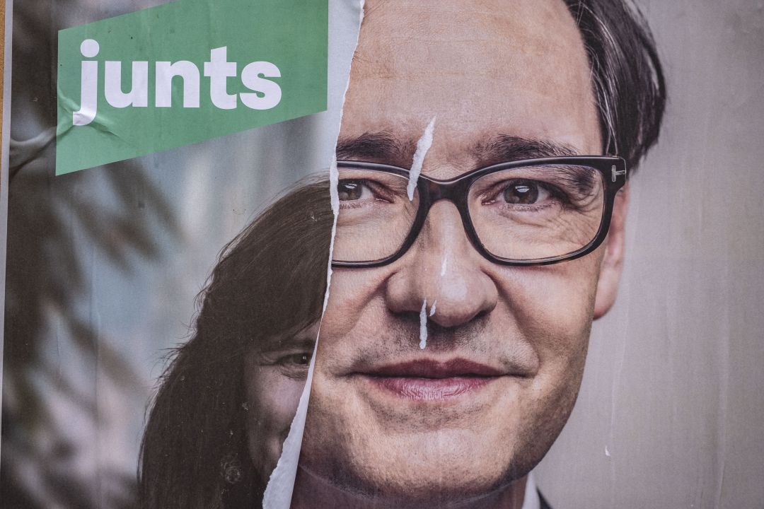 An electoral poster of the independence candidate, Laura Borràs is seen on La Rambla covered by another of the socialist candidate, Salvador Illa An electoral poster of the independence candidate, Laura Borràs is seen on La Rambla covered by another of the socialist candidate, Salvador Illa