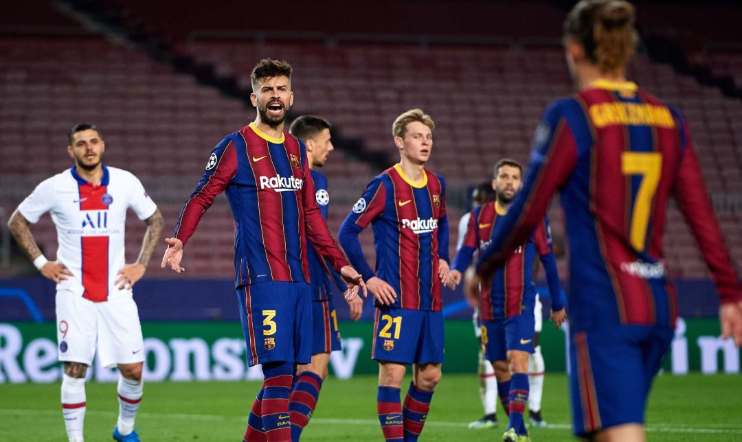 Gerard Piqué y Antoine Griezmann, en el partido entre el Barcelona y el PSG. Gerard Piqué y Antoine Griezmann, en el partido entre el Barcelona y el PSG.