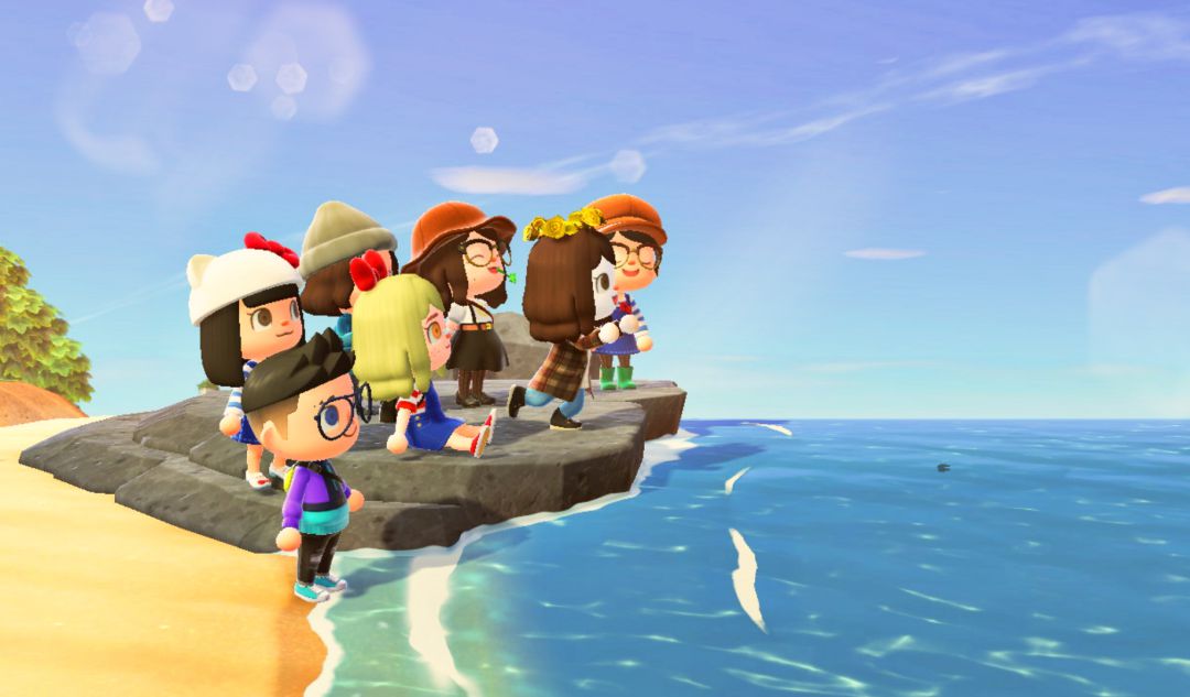 Grupo de amigos en la playa de una isla de Animal Crossing: New Horizons. Grupo de amigos en la playa de una isla de Animal Crossing: New Horizons.