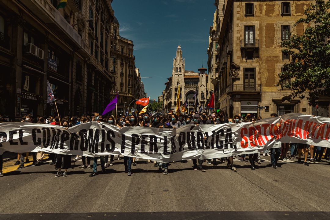 13 May 2021, Spain, Barcelona: Striking Catalan students march with a banner and flags as they protest the education crisis during the continuous spread of the coronavirus virus. 13 May 2021, Spain, Barcelona: Striking Catalan students march with a banner and flags as they protest the education crisis during the continuous spread of the coronavirus virus.