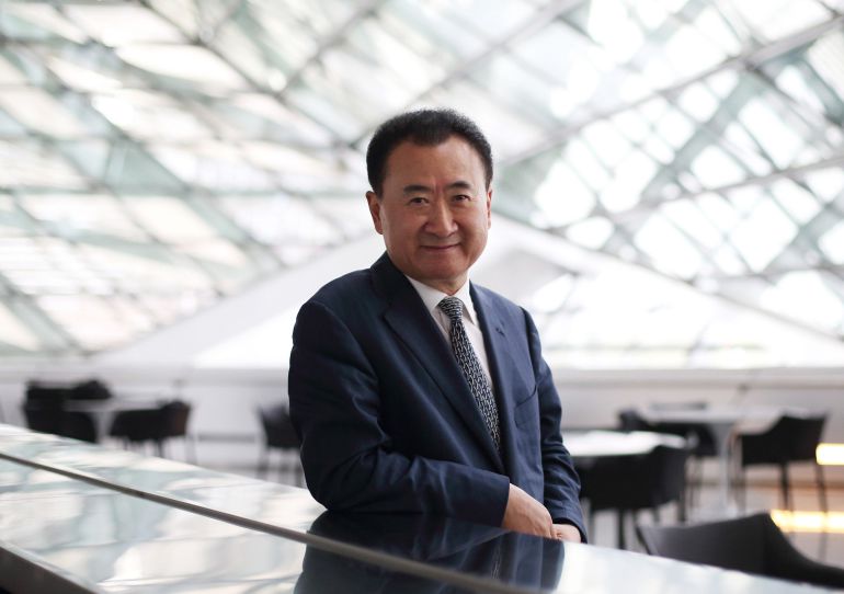 Billionaire Wang Jianlin, chairman and president of Dalian Wanda Group, poses for a portrait at the World Economic Forum Annual Meeting Of The New Champions in Dalian, China, on Wednesday, Sept. 11, 2013. Wang, China's richest man and owner of the country's biggest commercial land developer, said he has hired two investment banks to buy hotel management companies, mostly in the U.S. Photographer: Tomohiro Ohsumi/Bloomberg *** Local Caption *** Wang Jianlin