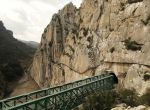 Journalists (C) walk along the new Caminito del Rey (The King's Little Pathway) in El Chorro-Alora, near Malaga, southern Spain March 15, 2015. Dubbed by many media outlets as the world's scariest pathway, the three-kilometre long pathway, which was built at about 100 metres (330 ft) above the gorge of Los Gaitanes between the years of 1901 and 1905, was closed in 2001 after five people died. A new walkway has then been built over the old walkway and will open to the public on March 28, 2015. REUTERS/Jon Nazca (SPAIN - Tags: SOCIETY TRAVEL ENVIRONMENT)