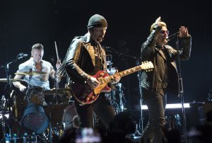 BARCELONA, SPAIN - OCTOBER 05: Larry Mullen Jr., The Edge and Bono of U2 perform on stage at Palau Sant Jordi on October 5, 2015 in Barcelona, Spain. (Photo by Jordi Vidal/Redferns)