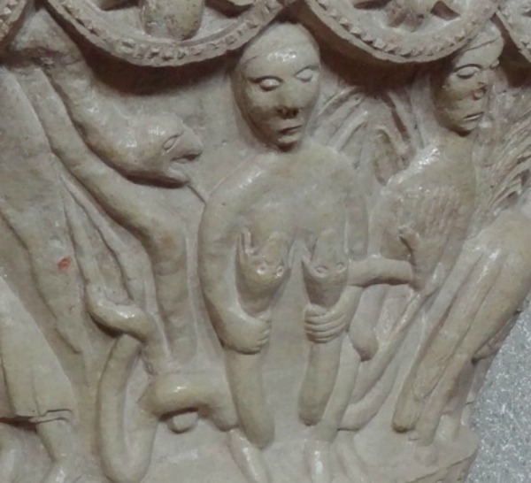 Representación de la lujuria en forma de mujer siendo devorada por dos serpientes. Pila bautismal de Rebanal de las Llantas (Palencia), siglo XII
