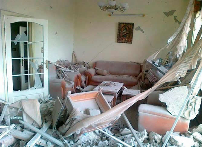 Una casa dañada el barrio sirio de Bab Amro, situado en el bastión opositor de Homs