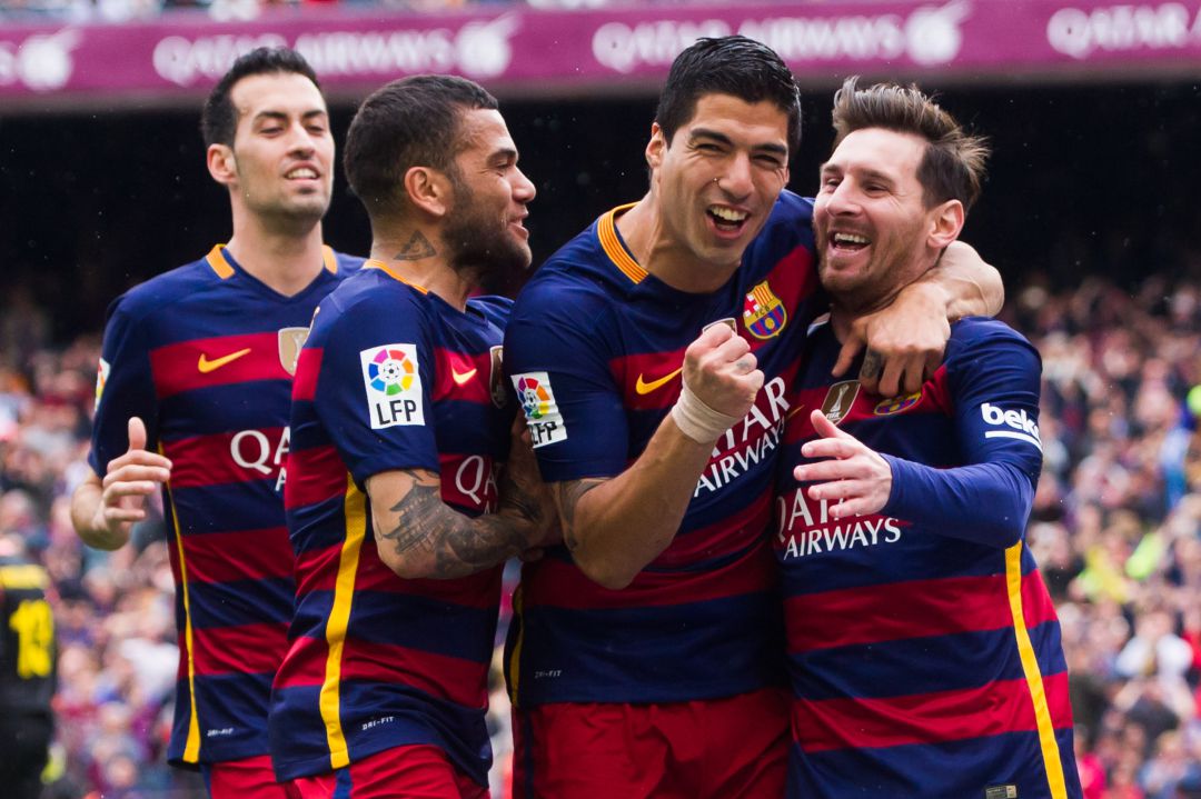 Sergio Busquets, Dani Alves, Luis Suárez y Messi en un partido ante el Espanyol en su época de jugador en el FC Barcelona. 