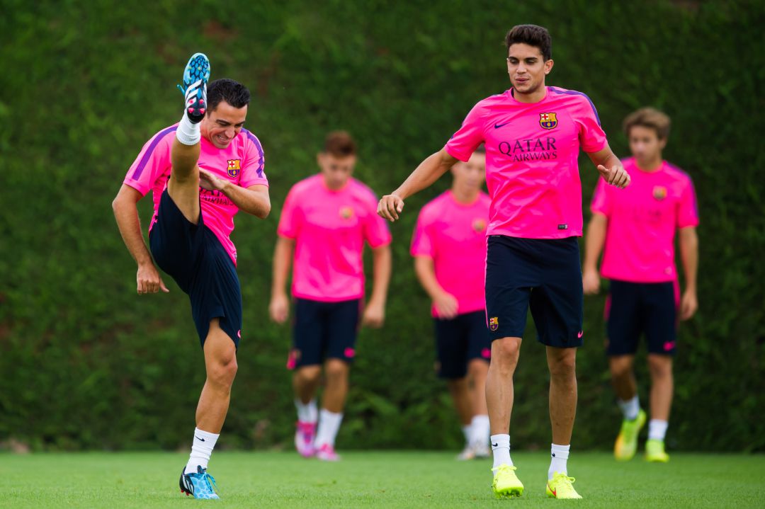 Xavi y Bartra, en su etapa como jugadores del Barcelona