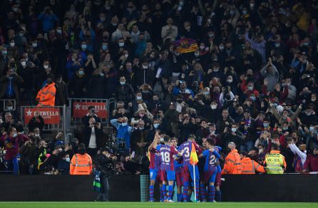 Barça fans celebrate a goal at the Camp Nou